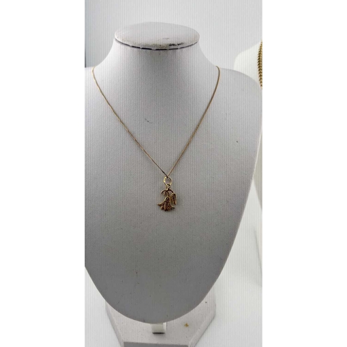 376 - A gold-coloured metal chain, apparently unmarked, with a pendant with Egyptian gold assay marks, gro... 