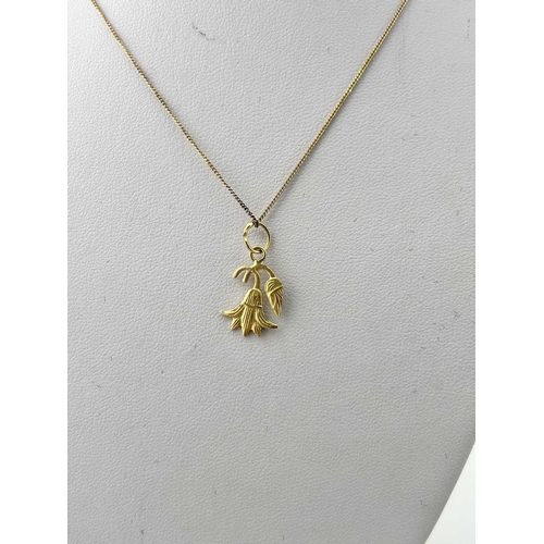 376 - A gold-coloured metal chain, apparently unmarked, with a pendant with Egyptian gold assay marks, gro... 