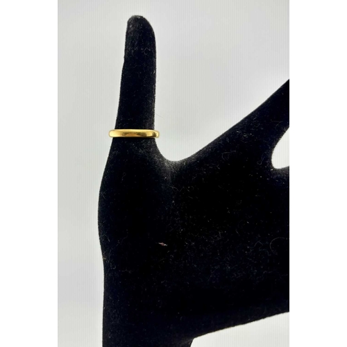 430 - A mid 20th century 22ct gold band ring, hallmarks for Birmingham 1957, ring N, width 3mm, 4g.