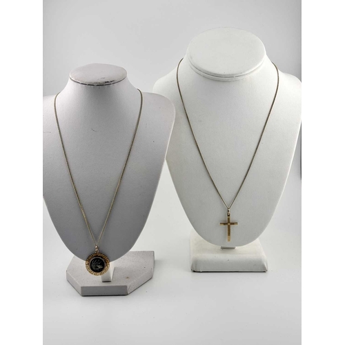 434 - Two gold-coloured metal pendants with chains, a cross and chain indistinctly stamped and with an oak... 