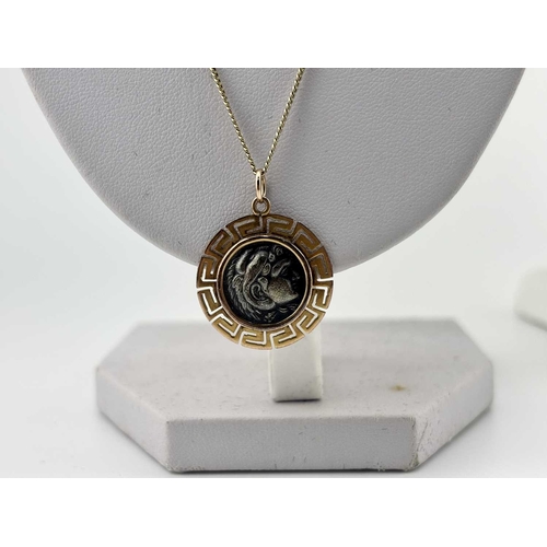 434 - Two gold-coloured metal pendants with chains, a cross and chain indistinctly stamped and with an oak... 