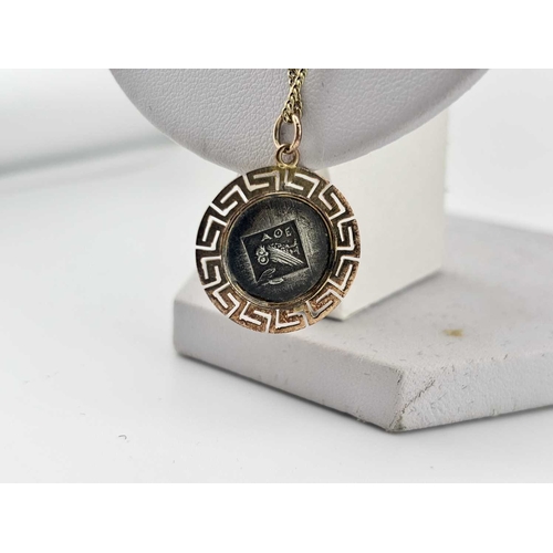 434 - Two gold-coloured metal pendants with chains, a cross and chain indistinctly stamped and with an oak... 