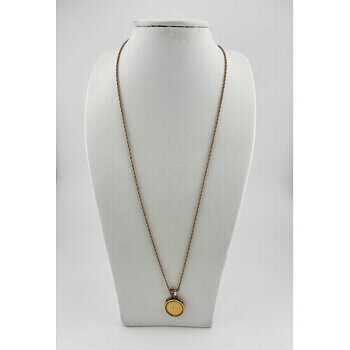 438 - A 9ct gold mounted half sovereign pendant, with chain, pendant mount with hallmarks for London 1962,... 