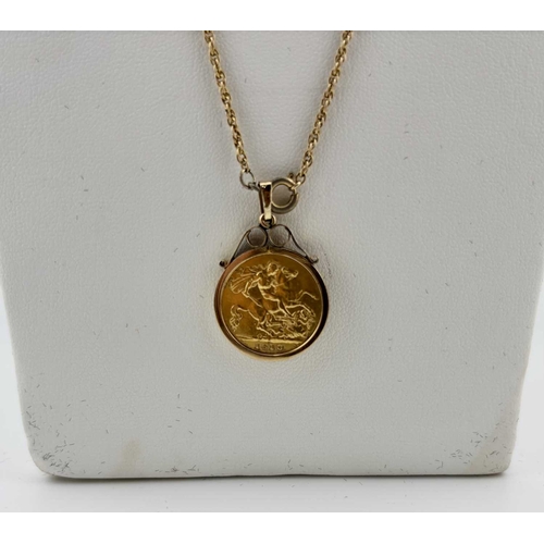 438 - A 9ct gold mounted half sovereign pendant, with chain, pendant mount with hallmarks for London 1962,... 