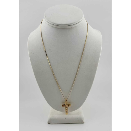 439 - A crucifix pendant, with serpentine-link chain, both stamped 750, length of pendant 3.6cm, length of... 