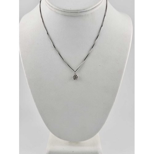 440 - A diamond ring and diamond pendant and chain, marks to the inside of the ring 'LAD 510', indistinct ... 