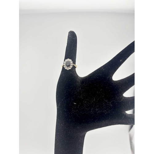 442 - A gold coloured metal sapphire and diamond cluster rings marked 18CT, gross weight 4.6g (1)