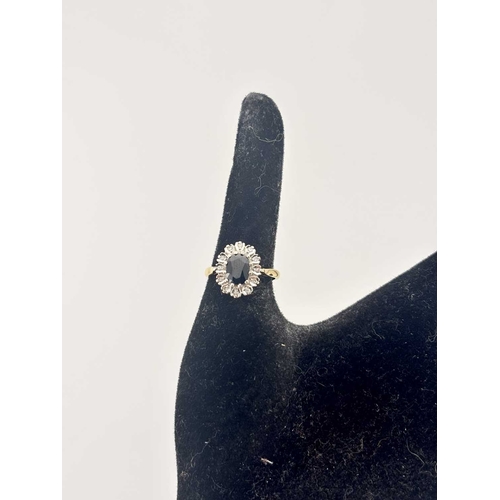 442 - A gold coloured metal sapphire and diamond cluster rings marked 18CT, gross weight 4.6g (1)