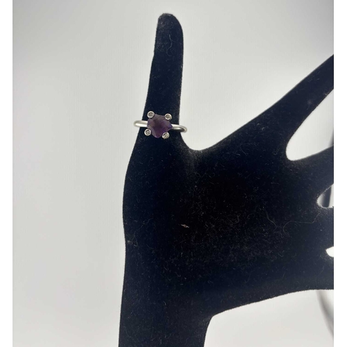 454 - An amethyst and diamond ring, stamped 750, ring size N, amethyst AF, 7.9g