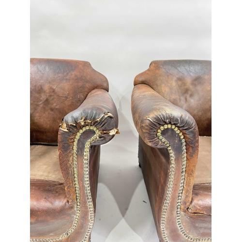 542 - An art deco brown leather three piece suite, low slung and deep seated, lyre shaped arms, with brass... 