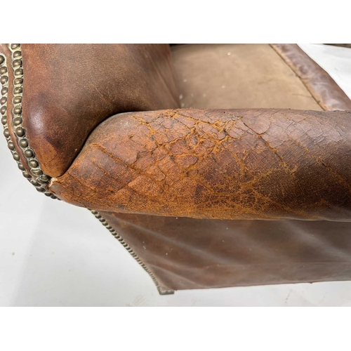 542 - An art deco brown leather three piece suite, low slung and deep seated, lyre shaped arms, with brass... 