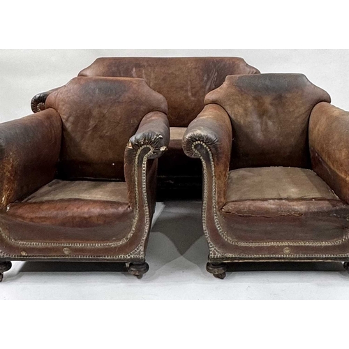 542 - An art deco brown leather three piece suite, low slung and deep seated, lyre shaped arms, with brass... 