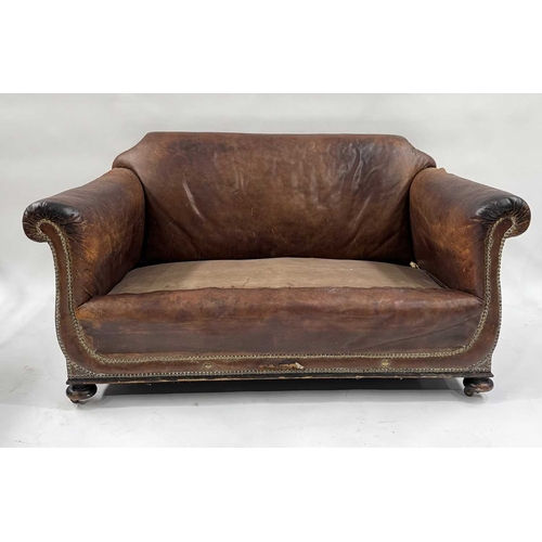 542 - An art deco brown leather three piece suite, low slung and deep seated, lyre shaped arms, with brass... 