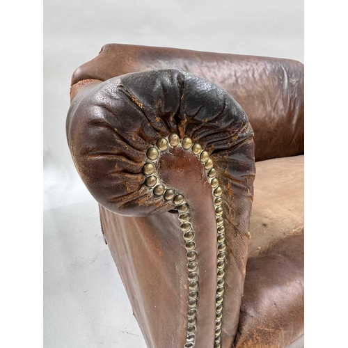 542 - An art deco brown leather three piece suite, low slung and deep seated, lyre shaped arms, with brass... 