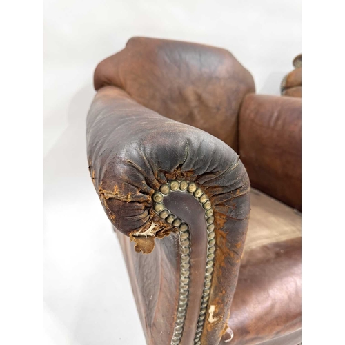 542 - An art deco brown leather three piece suite, low slung and deep seated, lyre shaped arms, with brass... 