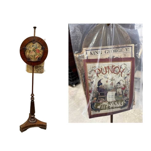 543 - A regency rosewood pole screen, tri-form base on winged feet, rising to a reeded baluster to a taper... 