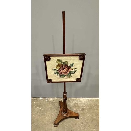 544 - A Regency mahogany pole screen with tapestry panel, triform platform base to a reeded column up to a... 