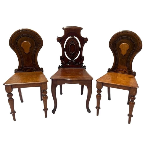 549 - A pair of 19th century light oak hall chairs, lightly carved backs with central blank cartouches, pl... 