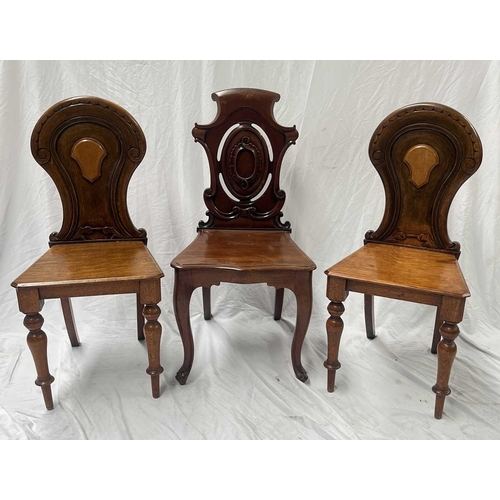 549 - A pair of 19th century light oak hall chairs, lightly carved backs with central blank cartouches, pl... 