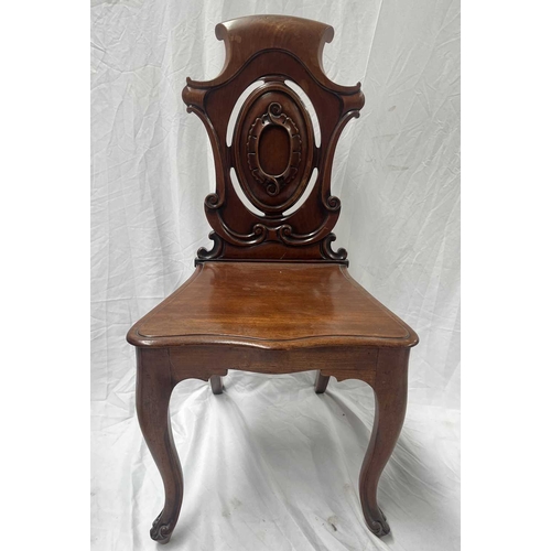 549 - A pair of 19th century light oak hall chairs, lightly carved backs with central blank cartouches, pl... 