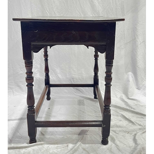 551 - An 18th century oak side table, 2 plank top, above a drawer with round knobs, turned legs united by ... 