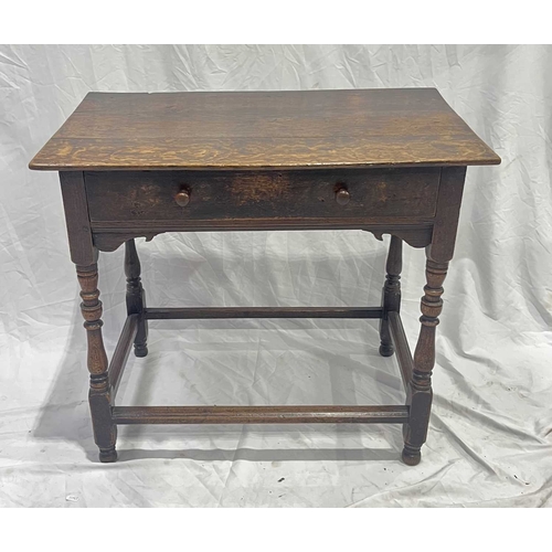 551 - An 18th century oak side table, 2 plank top, above a drawer with round knobs, turned legs united by ... 