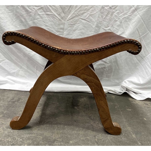 552 - A Spanish wood and leather x-frame stool, 20th century, Probably by Pierre Lottier for Valmazan, uph... 