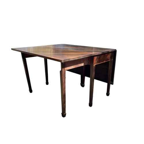 557 - A Georgian mahogany drop leaf dining table on square tapered legs, height 74cm, width 112cm, length ... 