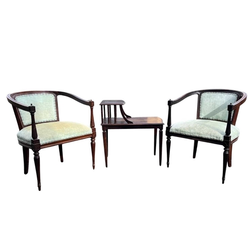 564 - A pair of early 20th century rosewood tub chairs, open sided, padded central back, on slim tapering ... 