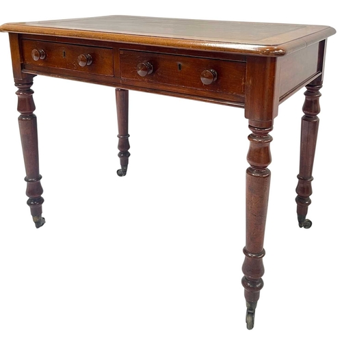 565 - A mid-19th century mahogany writing desk, leather inset top above a pair of drawers with round knobs... 