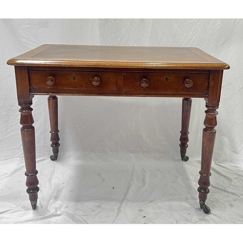 565 - A mid-19th century mahogany writing desk, leather inset top above a pair of drawers with round knobs... 