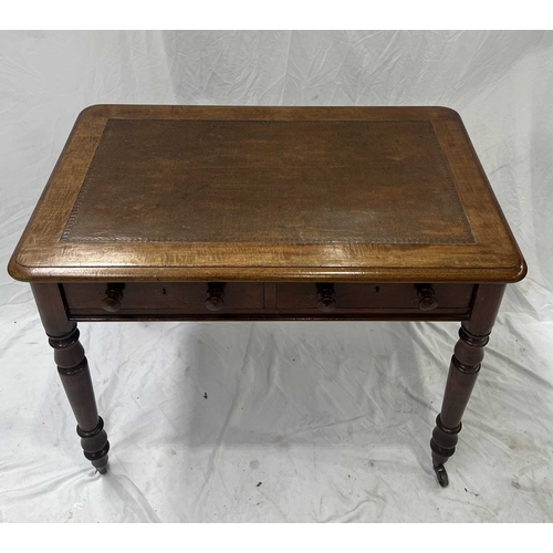565 - A mid-19th century mahogany writing desk, leather inset top above a pair of drawers with round knobs... 