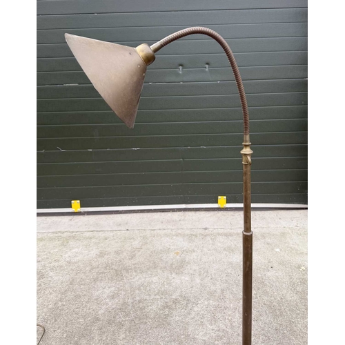 566A - A Laura Ashley brushed brass standard lamp, conical shade with adjustable neck, down to stepped weig... 