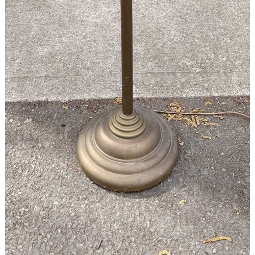 566A - A Laura Ashley brushed brass standard lamp, conical shade with adjustable neck, down to stepped weig... 