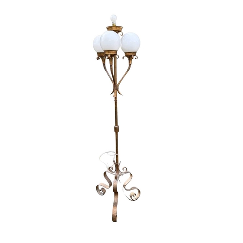 567 - A gilded wrought metal 4-light standard lamp, central column with light supported by scrolls above t... 