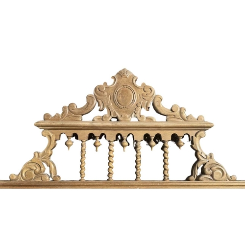 573A - A Spanish or Portuguese wooden bed headboard, barley twist newel posts surmounted by urn finials, ce... 