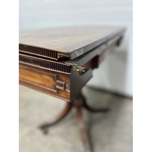 573 - A Regency mahogany fold over card table, dentilled top with concertina action, green baize, cut corn... 
