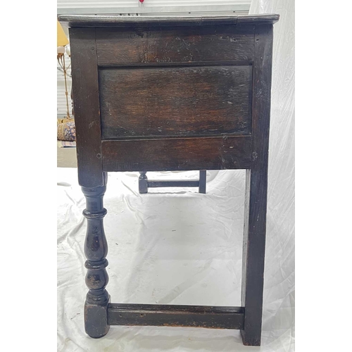 580 - A Jacobean oak dresser base or sideboard, two plank top above three deep drawers each with a central... 