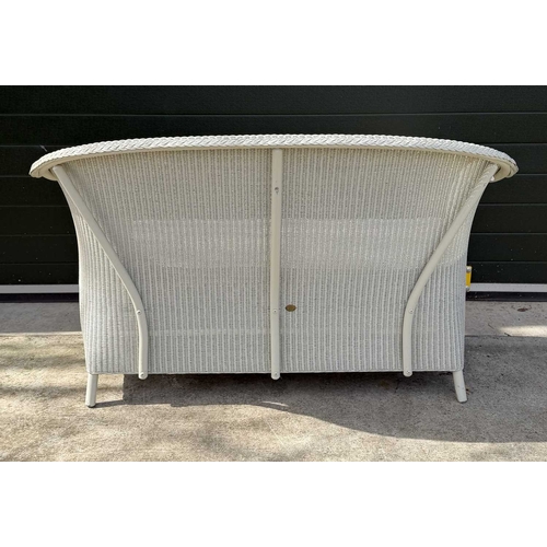 584 - A Lloyd Loom of Spalding white painted sofa, with loose fitted cushion in a blue an white fabric, he... 