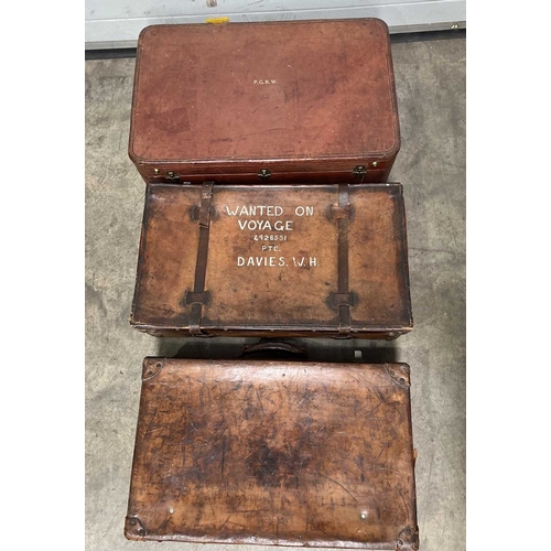 586 - A large brown leather suitcase, brassed fittings and studs for feet, brown silk interior, height app... 