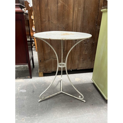 591 - A white-painted metal, garden or orangery, table, round top to three wrought legs supported by a tri... 
