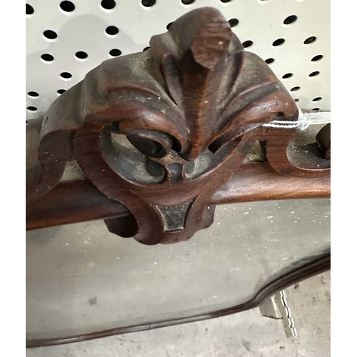 594 - A carved beech-framed wall mirror, the frame with cut-out trefoil shapes in roundels, height 88.5cm,... 