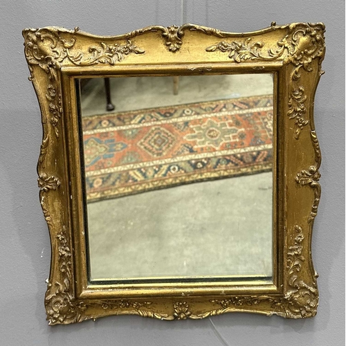 595 - A mahogany Empire design pier glass, 19th Century, probably French, cornice above panel with metal i... 