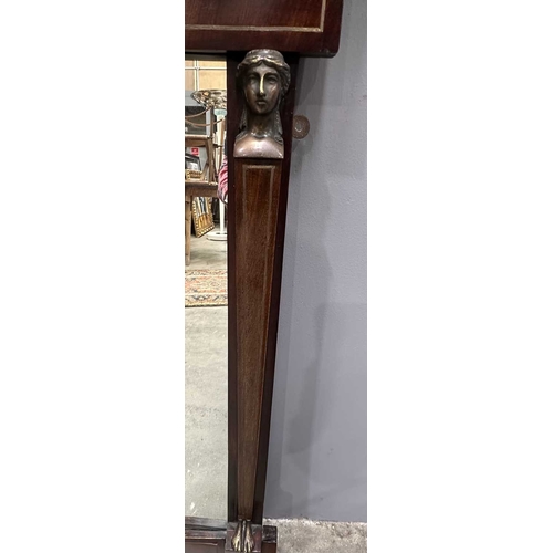 595 - A mahogany Empire design pier glass, 19th Century, probably French, cornice above panel with metal i... 