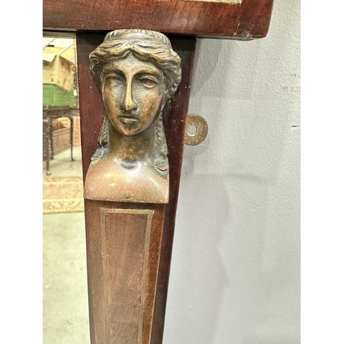 595 - A mahogany Empire design pier glass, 19th Century, probably French, cornice above panel with metal i... 