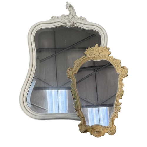 600 - A painted wooden wall mirror, bombe form with asymmetric rococo carving to the top, bevelled glass p... 