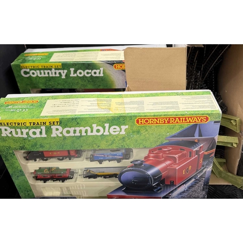 64 - Two Hornby electric train sets to include 'The Rural Rambler' and 'The Country Local' also to includ... 