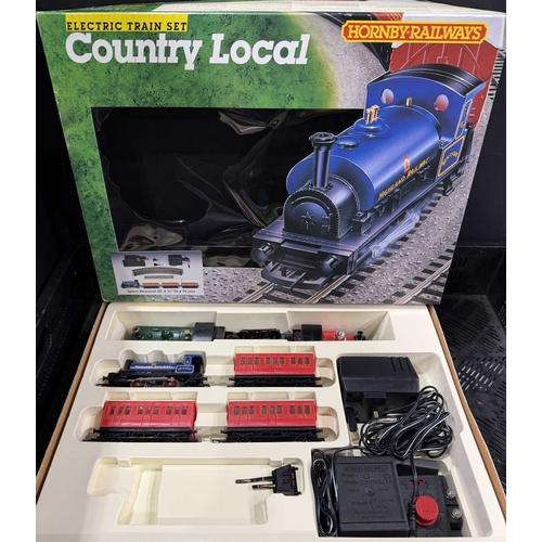 64 - Two Hornby electric train sets to include 'The Rural Rambler' and 'The Country Local' also to includ... 