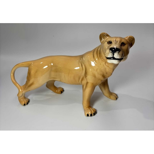 81 - A Beswick ceramic lion, height approx 13.5cm, together with a lioness, height 14cm and an elephant (... 
