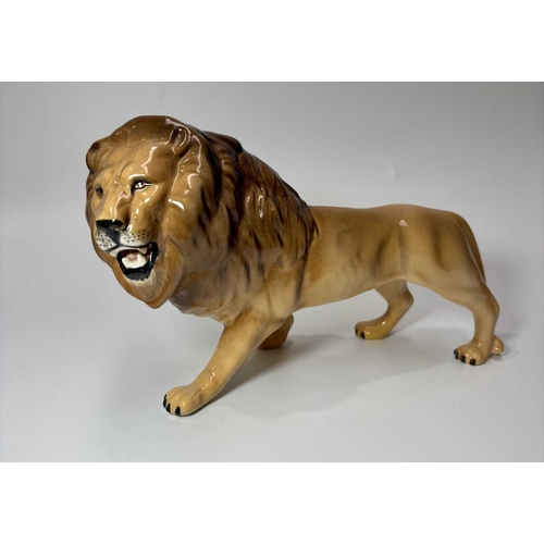 81 - A Beswick ceramic lion, height approx 13.5cm, together with a lioness, height 14cm and an elephant (... 